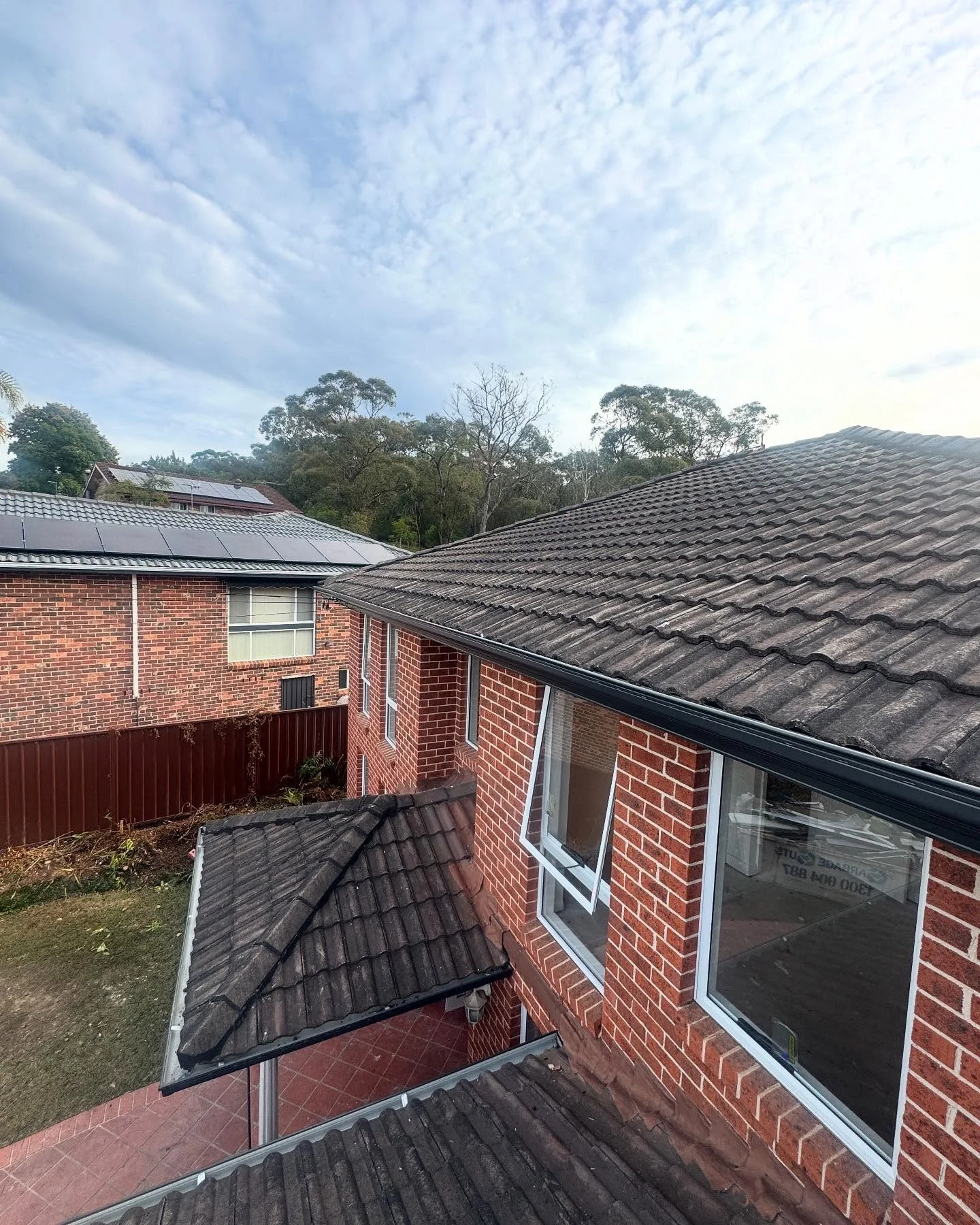 Emergency roof tarping after storm damage on an Ocala property